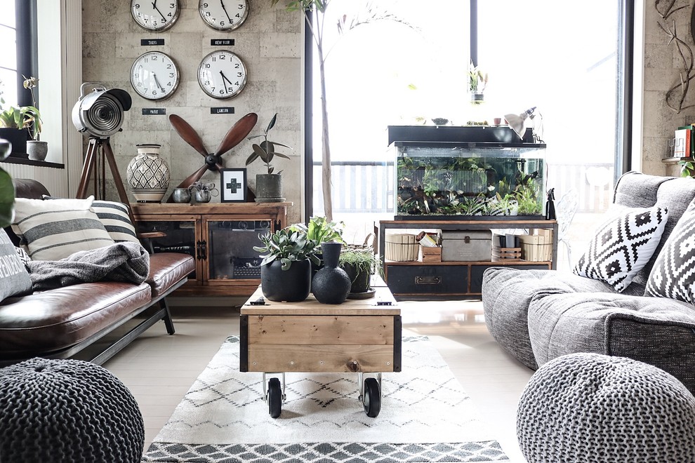 Living room - mid-sized industrial enclosed laminate floor and gray floor living room idea in Melbourne with no fireplace, a plaster fireplace and no tv