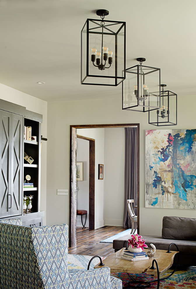Example of a mid-sized transitional formal and enclosed medium tone wood floor and brown floor living room design in Other with white walls