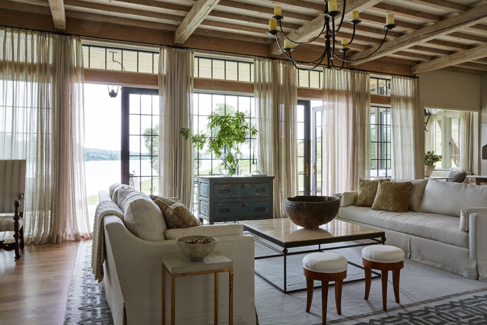 Inspiration for a rural open plan living room in New Orleans with medium hardwood flooring and brown floors.