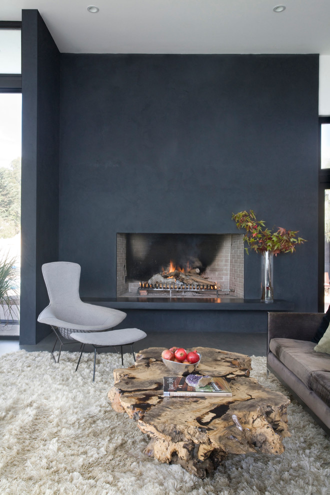 Inspiration for a modern living room remodel in San Diego with black walls