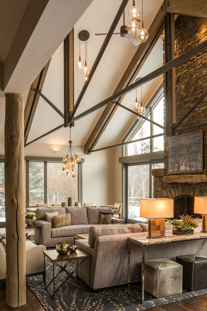 Inspiration for a large rustic formal open plan living room in Other with beige walls, a standard fireplace, a stone fireplace surround and no tv.