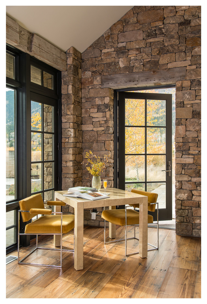 Example of a mid-sized mountain style dining room design in Other