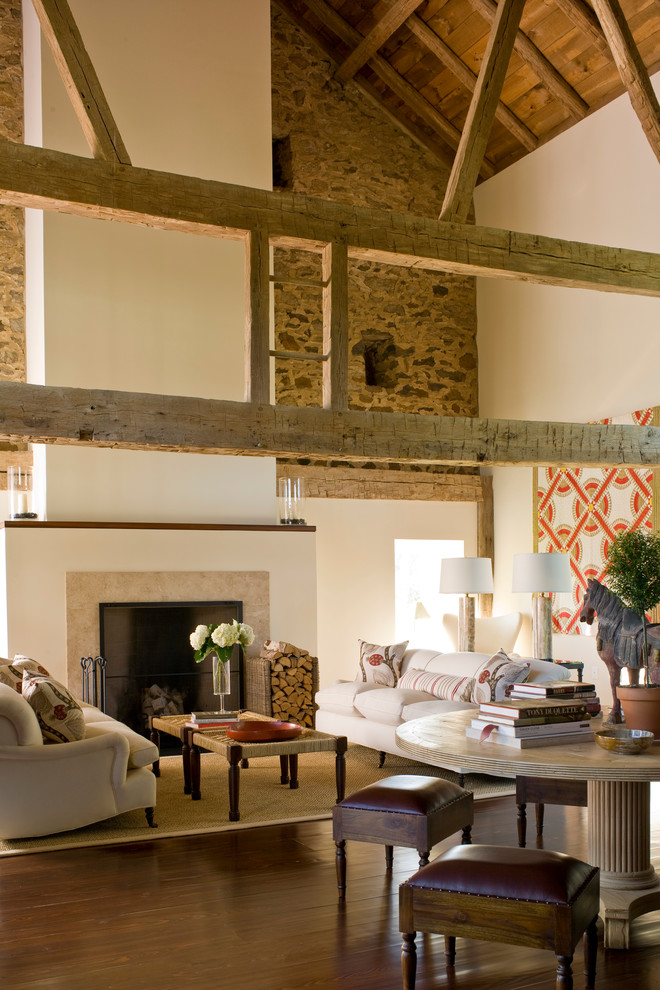 Inspiration for an expansive rural formal open plan living room in New York with white walls, medium hardwood flooring, a standard fireplace and a stone fireplace surround.