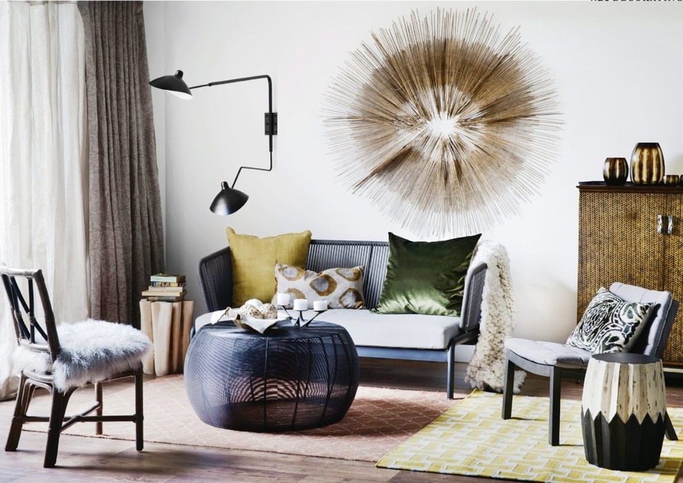 Medium sized bohemian open plan living room in Sydney with white walls and medium hardwood flooring.