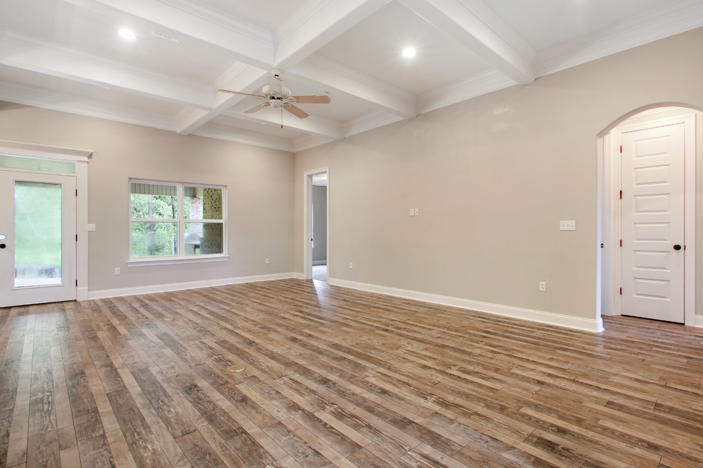 Foto di un grande soggiorno classico aperto con pavimento in laminato