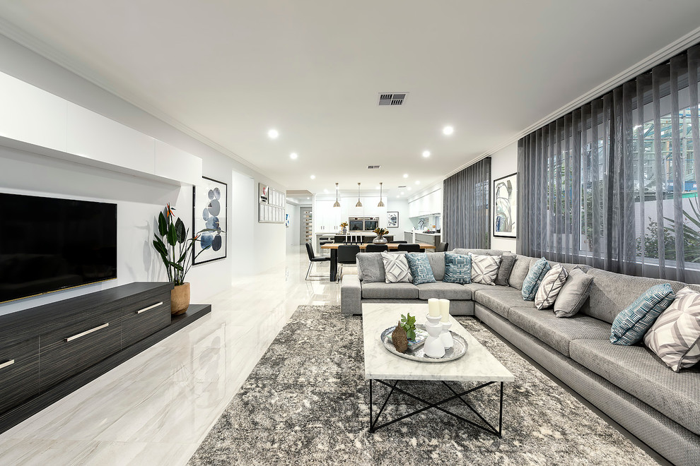 Large contemporary open plan living room in Perth with white walls, porcelain flooring and a wall mounted tv.