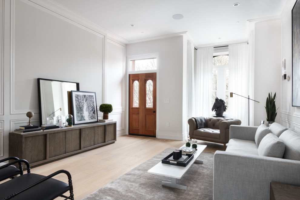 Inspiration for a large scandinavian enclosed living room in Other with white walls, light hardwood flooring, beige floors and panelled walls.