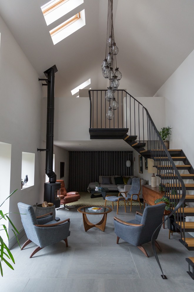 Medium sized retro mezzanine living room in Other with slate flooring and grey floors.