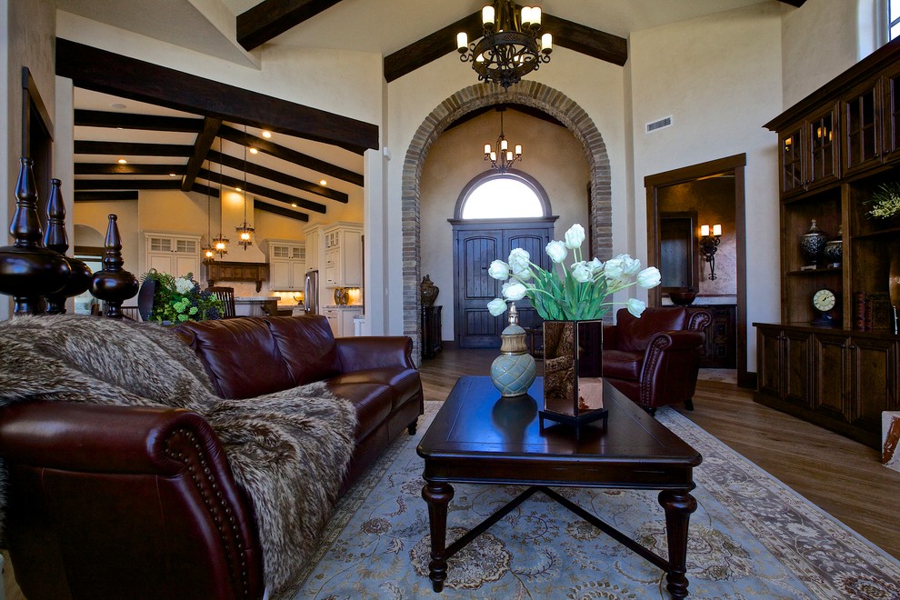 Large tuscan formal and enclosed light wood floor living room photo in Seattle with brown walls, a standard fireplace, a plaster fireplace and a media wall