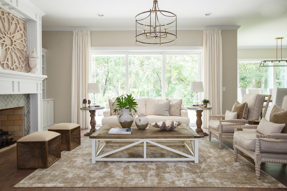 Living room - mid-sized traditional formal and open concept dark wood floor and brown floor living room idea in Jacksonville with beige walls, a standard fireplace and a tile fireplace