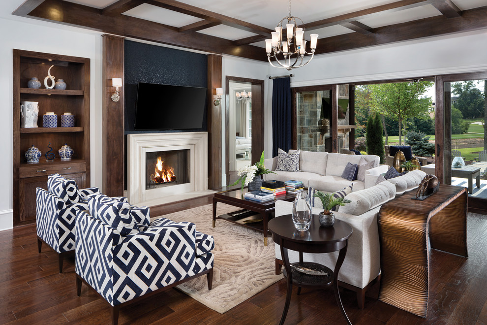 Mid-sized transitional open concept dark wood floor living room photo in Atlanta with white walls, a standard fireplace, a wood fireplace surround and a wall-mounted tv