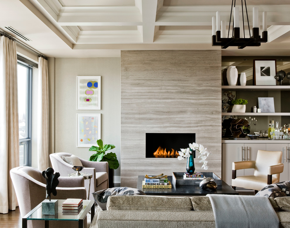 Example of a large transitional formal and open concept medium tone wood floor, brown floor and tray ceiling living room design in Boston with beige walls, a ribbon fireplace, a stone fireplace and no tv