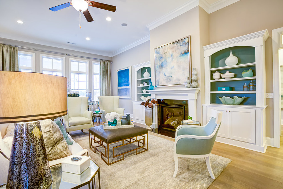 Large beach style open concept light wood floor living room photo in Wilmington with gray walls and a standard fireplace