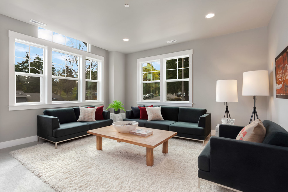 Photo of a large contemporary enclosed living room in Seattle with carpet.