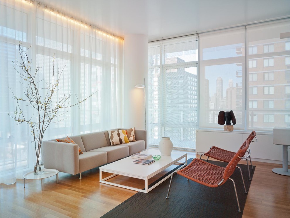 Living room - contemporary open concept medium tone wood floor living room idea in New York