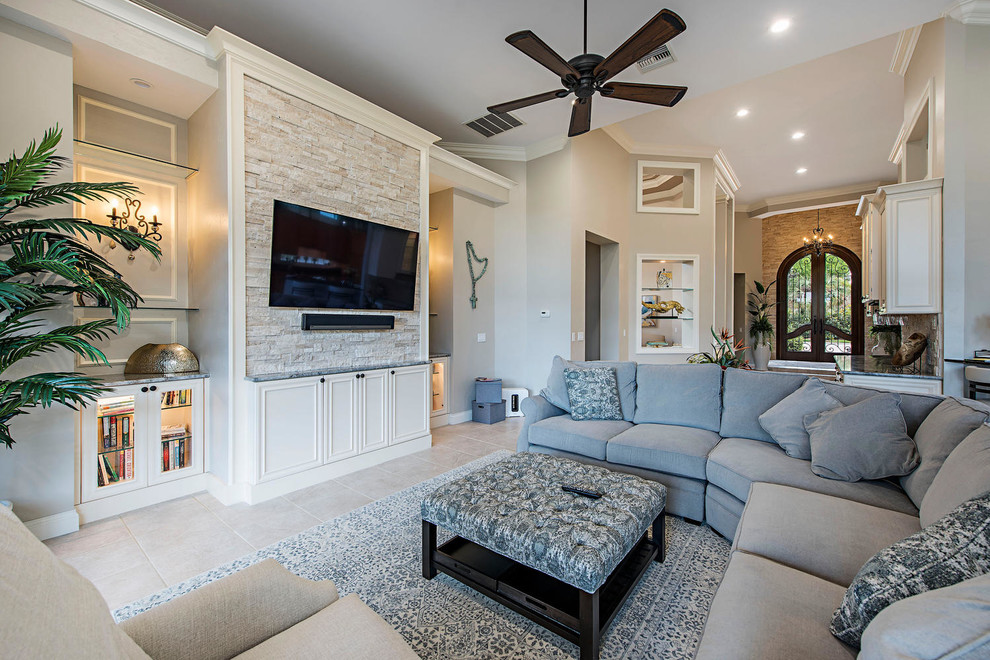 Inspiration for a medium sized traditional open plan living room in Tampa with beige walls, porcelain flooring, a wall mounted tv and beige floors.