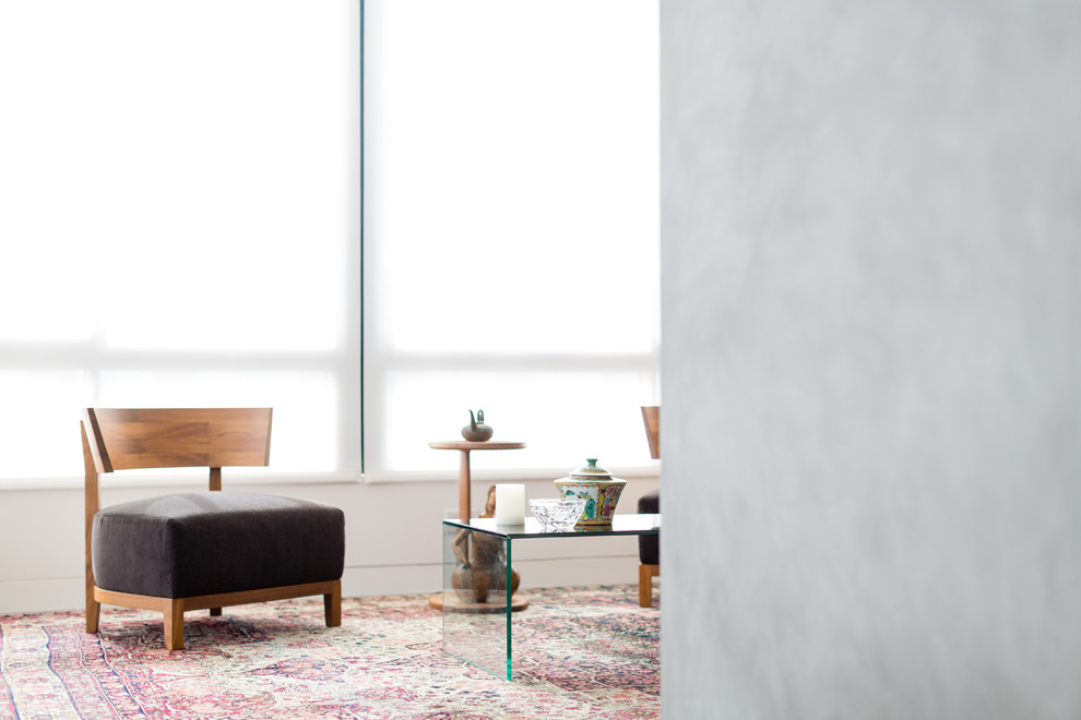 Ispirazione per un piccolo soggiorno minimalista aperto con pareti bianche, pavimento in gres porcellanato, nessun camino e nessuna TV