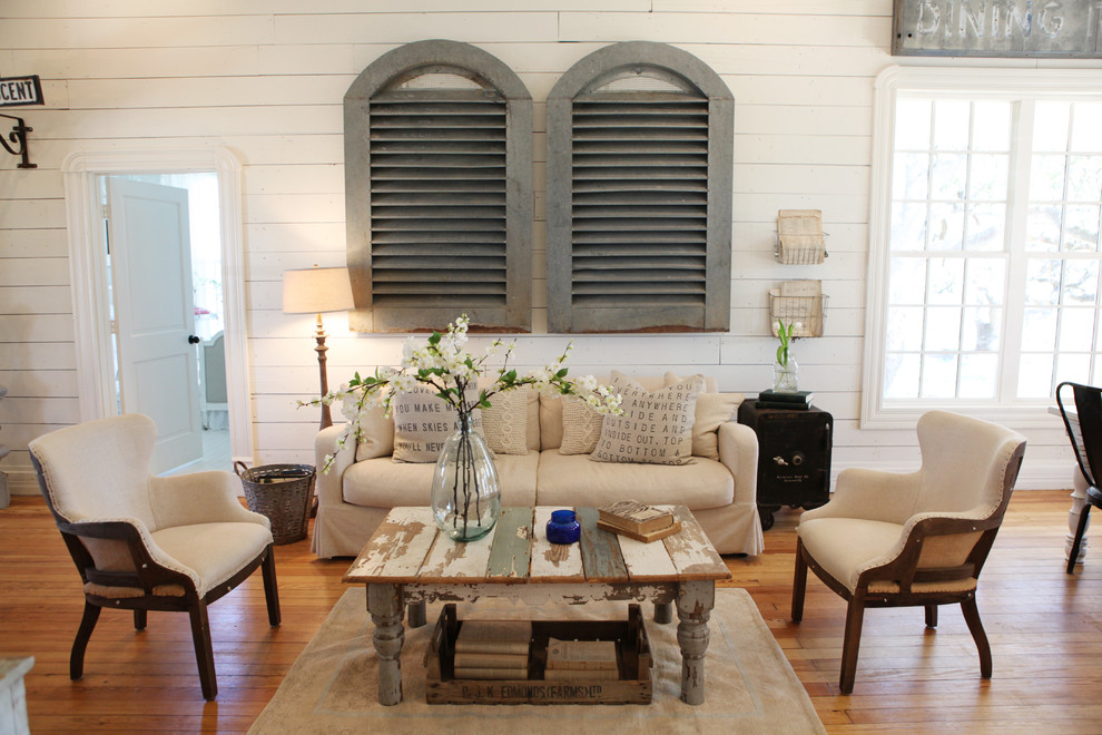 Living room - mid-sized shabby-chic style open concept and formal medium tone wood floor living room idea in Austin with white walls, no fireplace and no tv
