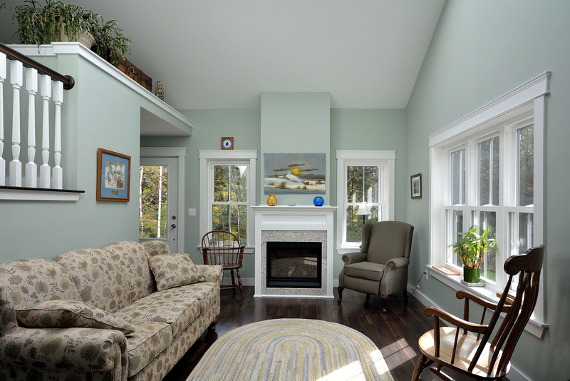 Living room - small traditional enclosed dark wood floor living room idea in Portland Maine with blue walls and no tv