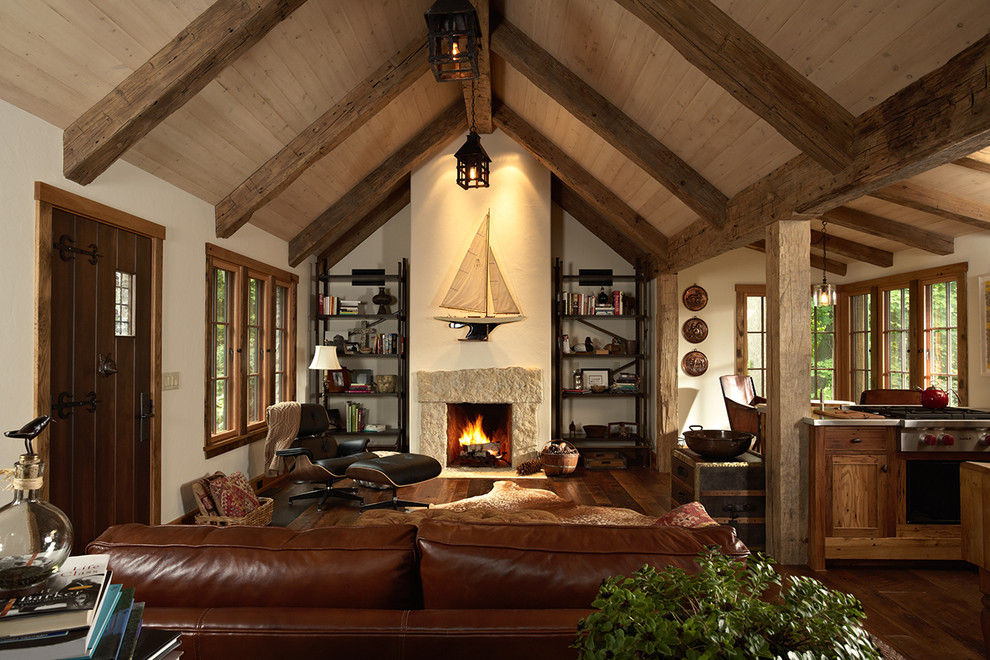 Inspiration for a rustic dark wood floor living room remodel in Minneapolis with a standard fireplace