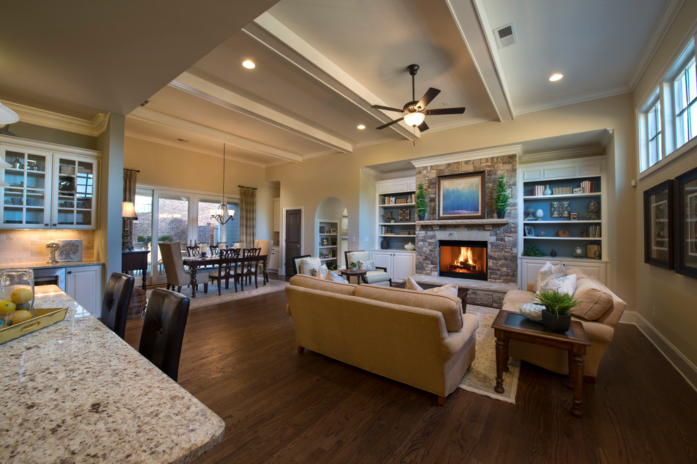 Living room - large traditional formal and open concept medium tone wood floor living room idea in Atlanta with beige walls, a standard fireplace, a stone fireplace and no tv