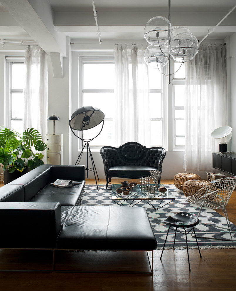Inspiration for a victorian enclosed medium tone wood floor living room remodel in New York with white walls