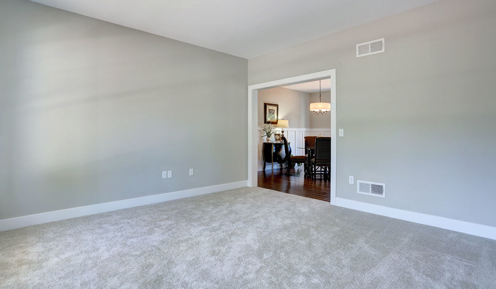 Example of a mid-sized country formal and enclosed carpeted and beige floor living room design in Other with gray walls