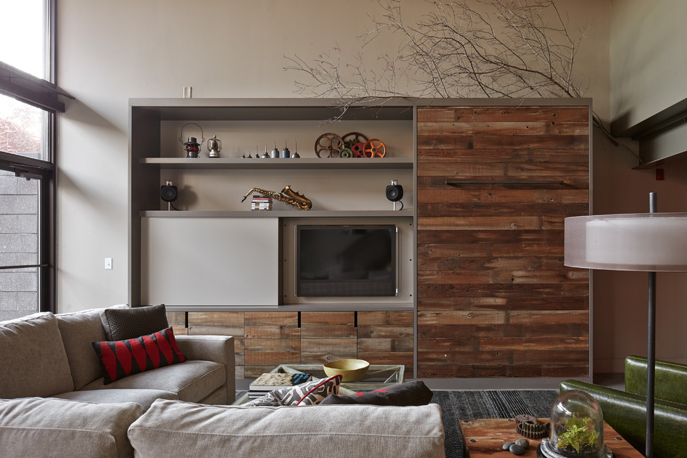 Design ideas for an industrial living room in Kansas City with a concealed tv.