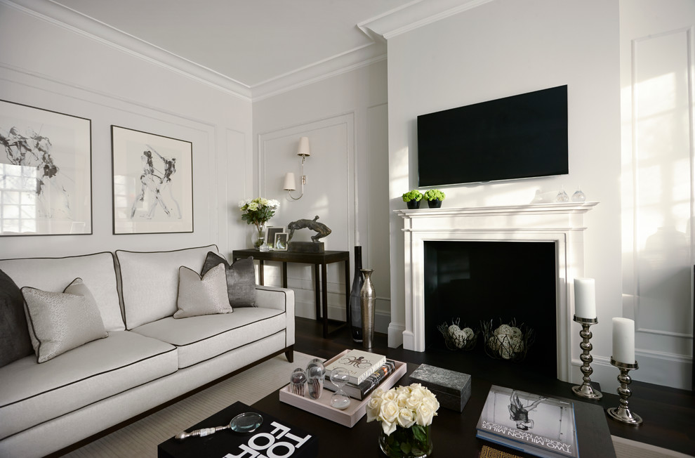 Example of a trendy formal dark wood floor living room design in London with white walls and a wall-mounted tv