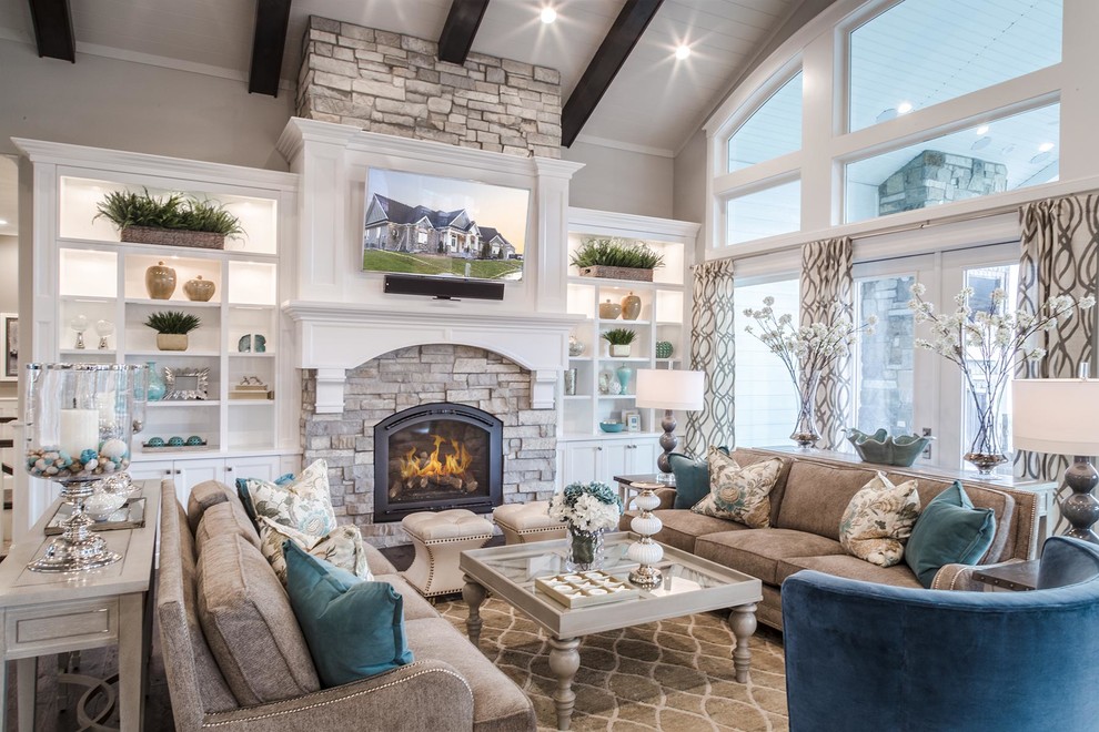 Photo of a large traditional open plan living room in Salt Lake City with a standard fireplace, a stone fireplace surround, a wall mounted tv, white walls, medium hardwood flooring, brown floors and feature lighting.
