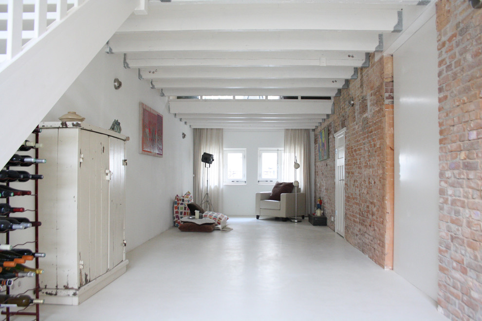 Industrial living room in Amsterdam with white floors.