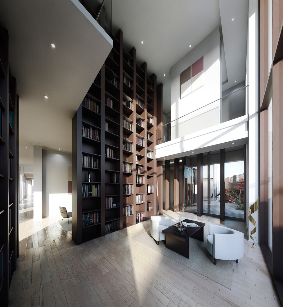 Large minimalist open concept living room library photo in London with no tv