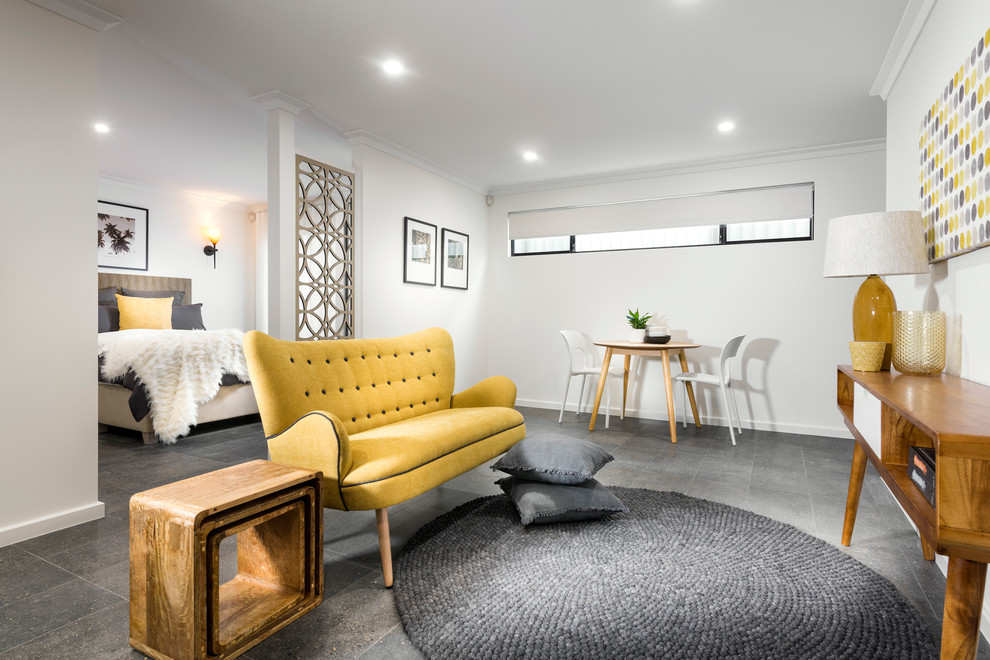 Immagine di un soggiorno minimalista con pareti bianche, pavimento con piastrelle in ceramica e pavimento grigio