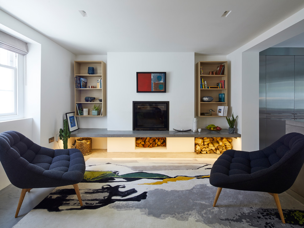 Ispirazione per un soggiorno design di medie dimensioni con pareti bianche, pavimento in cemento, stufa a legna e pavimento grigio