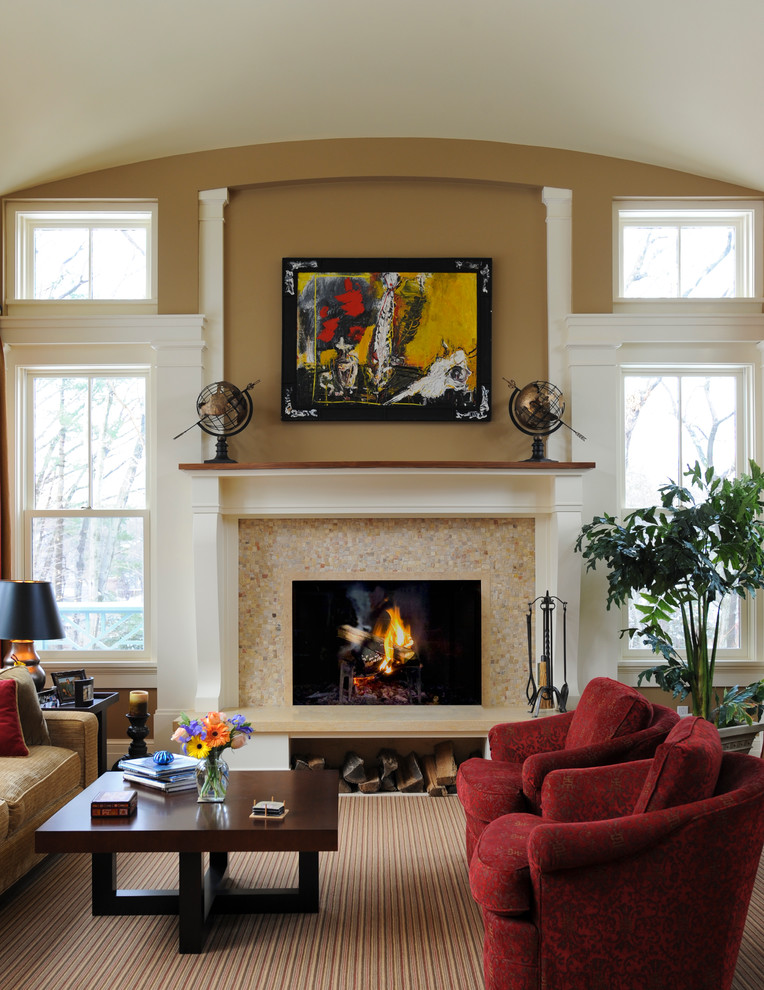 Traditional living room in Boston with beige walls and a standard fireplace.