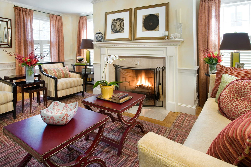 Elegant living room photo in Boston with beige walls and a standard fireplace