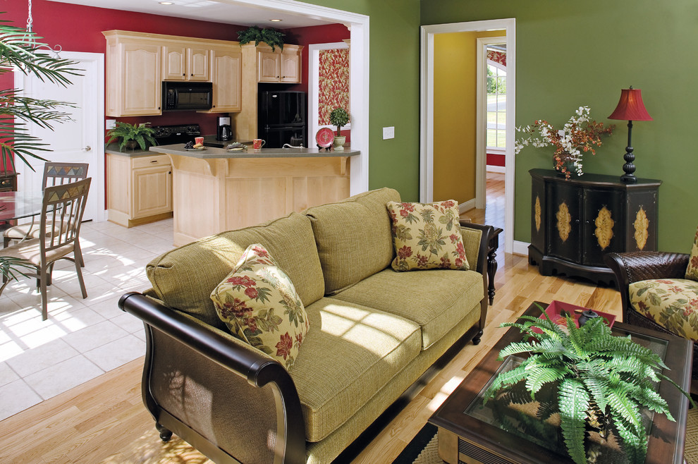 Photo of a medium sized classic open plan living room in Other with green walls, light hardwood flooring, a standard fireplace and no tv.