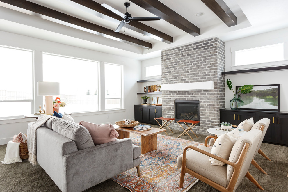Inspiration for a transitional carpeted and gray floor living room remodel in Boise with white walls, a standard fireplace and a brick fireplace