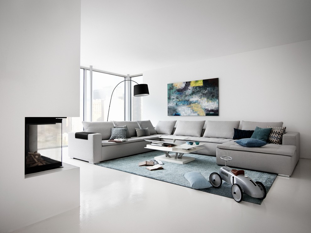 Trendy living room photo in London with white walls