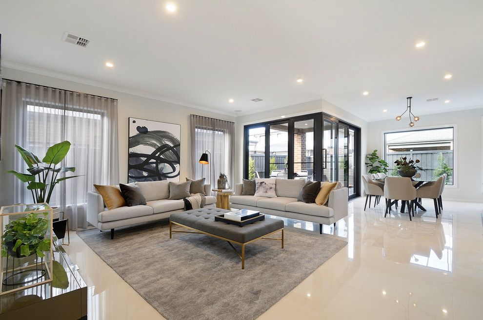 Kleines, Repräsentatives, Fernseherloses, Offenes Modernes Wohnzimmer ohne Kamin mit grauer Wandfarbe, Teppichboden und grauem Boden in Melbourne