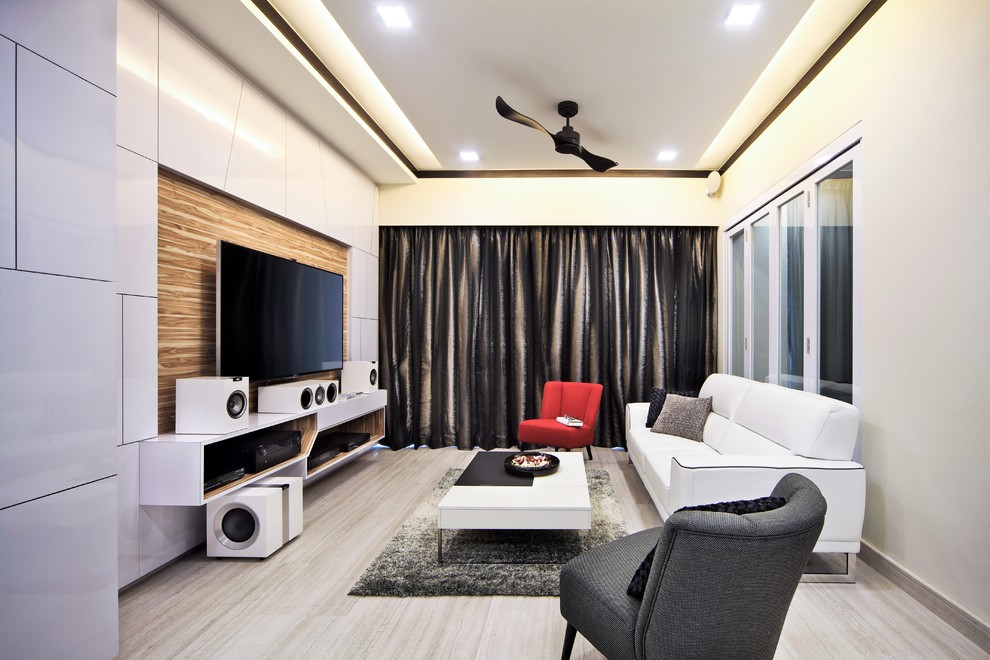 This is an example of a small modern living room with a wall mounted tv and white walls.