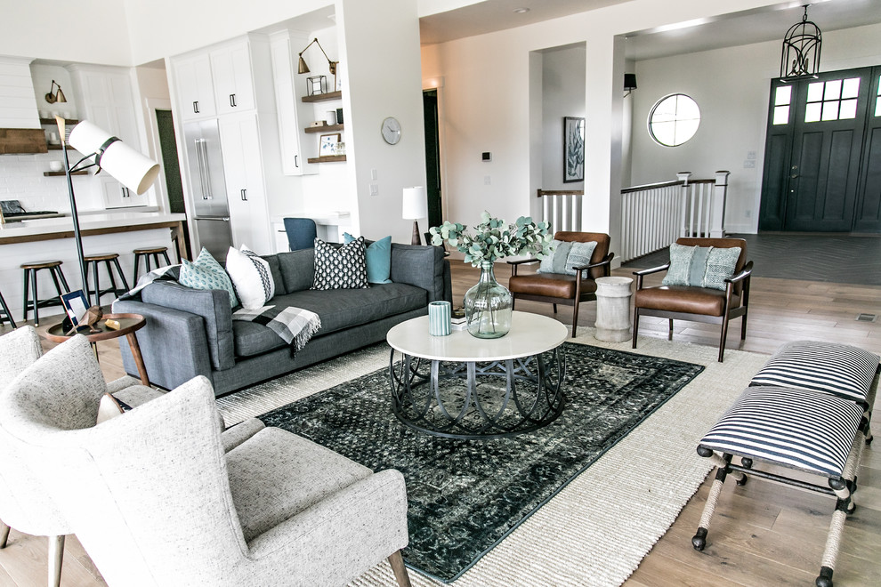 Medium sized rural formal open plan living room in Salt Lake City with white walls, medium hardwood flooring, brown floors and feature lighting.