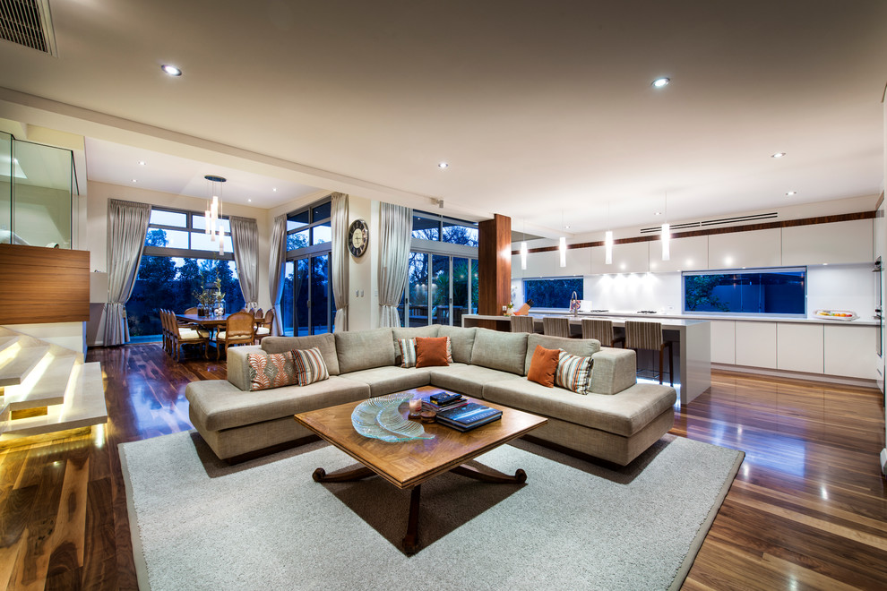 Medium sized contemporary open plan living room in Perth with white walls and dark hardwood flooring.