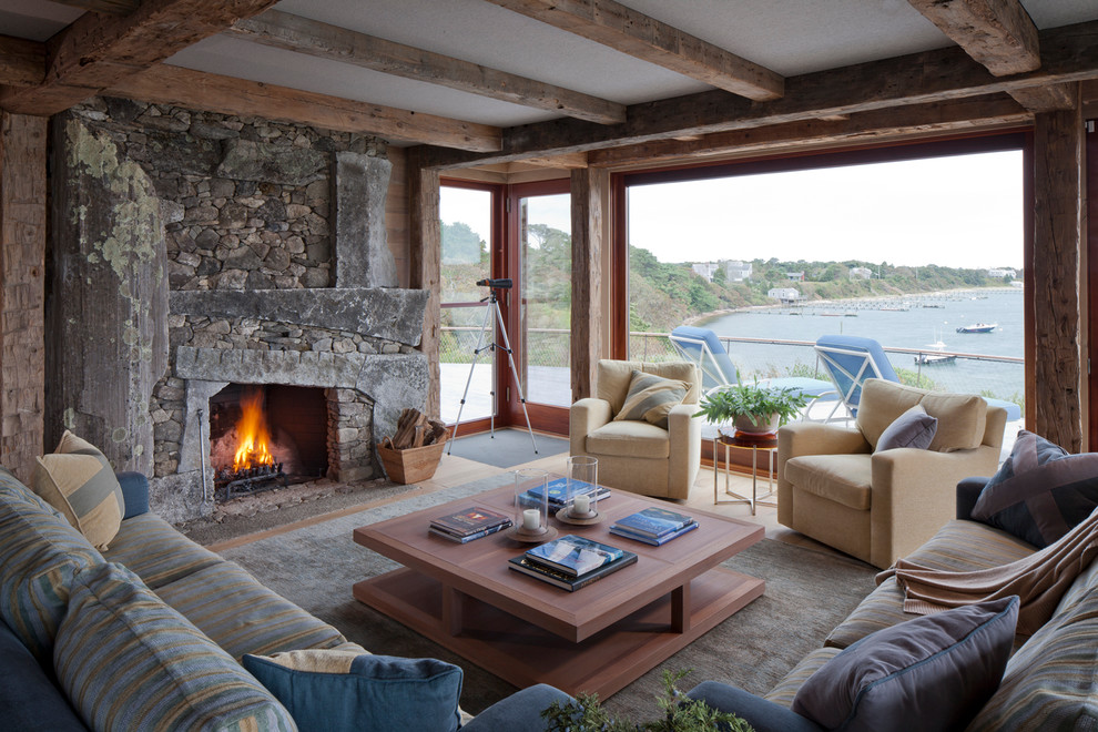 Inspiration for a rustic formal living room in Boston with a standard fireplace, a stone fireplace surround and no tv.