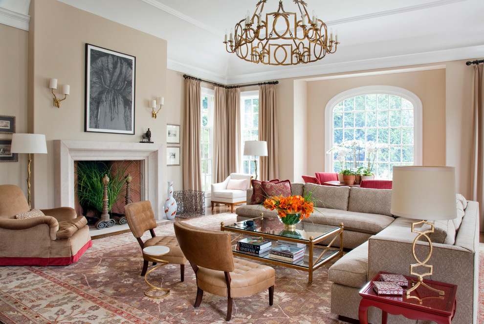 Photo of a traditional living room in Boston with beige walls and a standard fireplace.