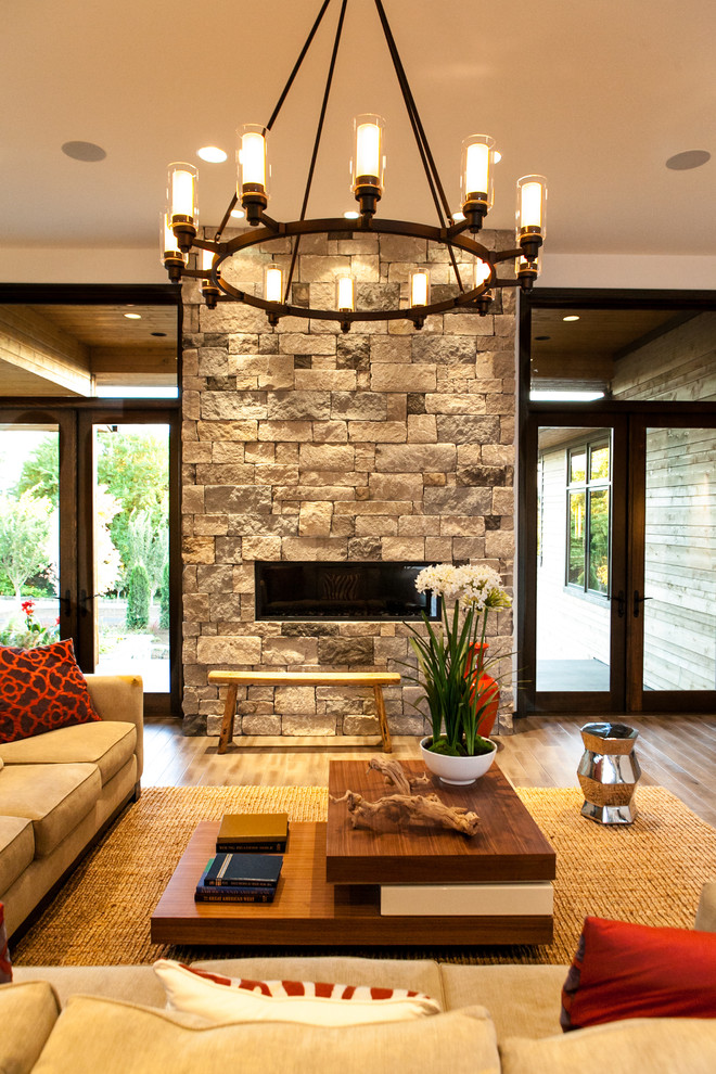 Living room - large contemporary formal and open concept living room idea in Portland with a standard fireplace and a stone fireplace