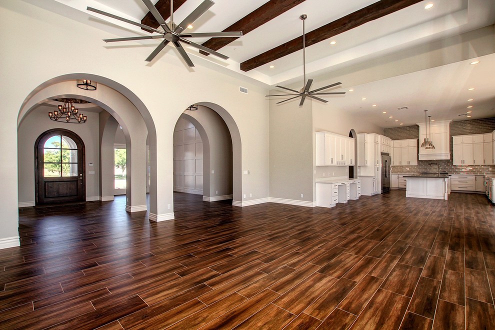 Example of a mid-sized transitional formal and enclosed dark wood floor and brown floor living room design in Phoenix with gray walls