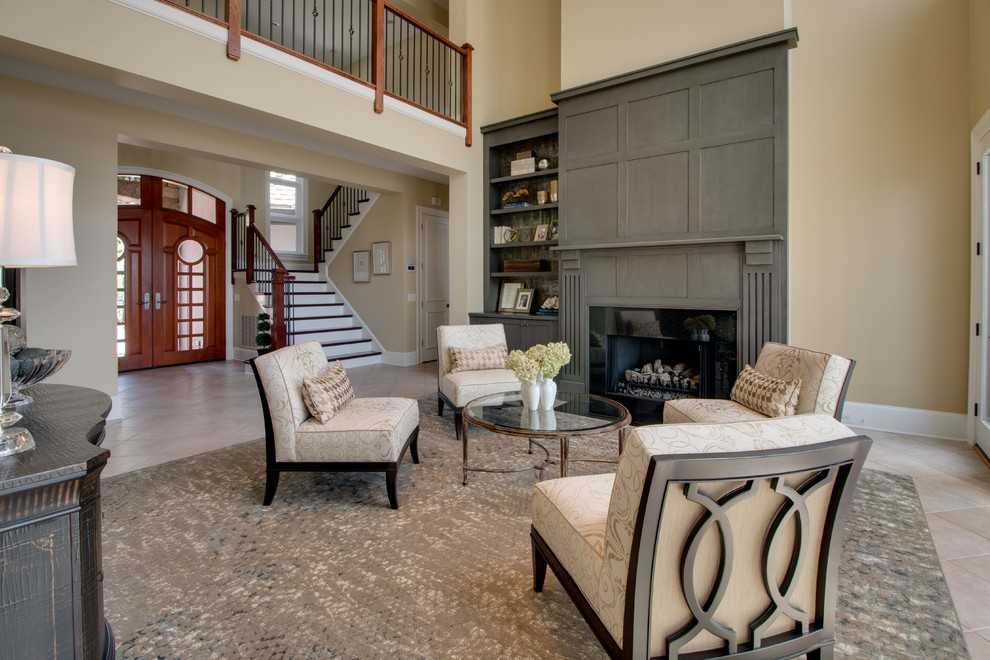 Example of a large trendy open concept porcelain tile and beige floor living room design in Charlotte with a music area, beige walls, a standard fireplace, a tile fireplace and no tv