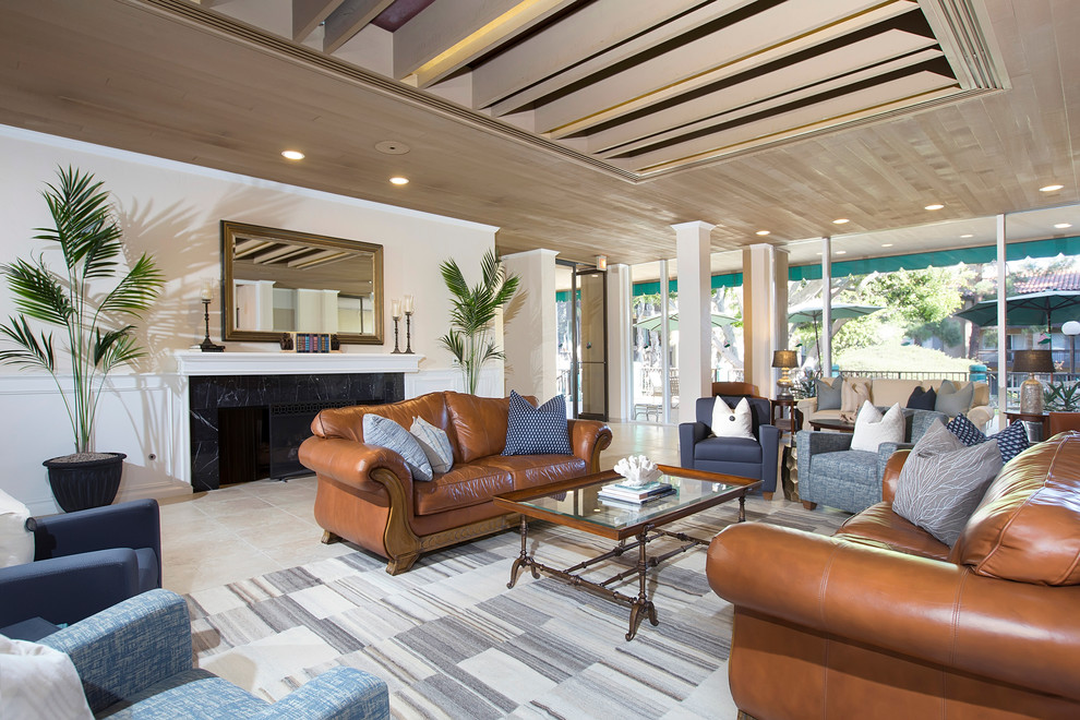 Example of a large beach style formal and open concept travertine floor and beige floor living room design in San Diego with beige walls, a standard fireplace and a tile fireplace