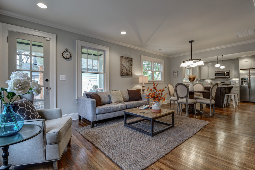 Photo of a small classic open plan living room in Atlanta with grey walls and medium hardwood flooring.